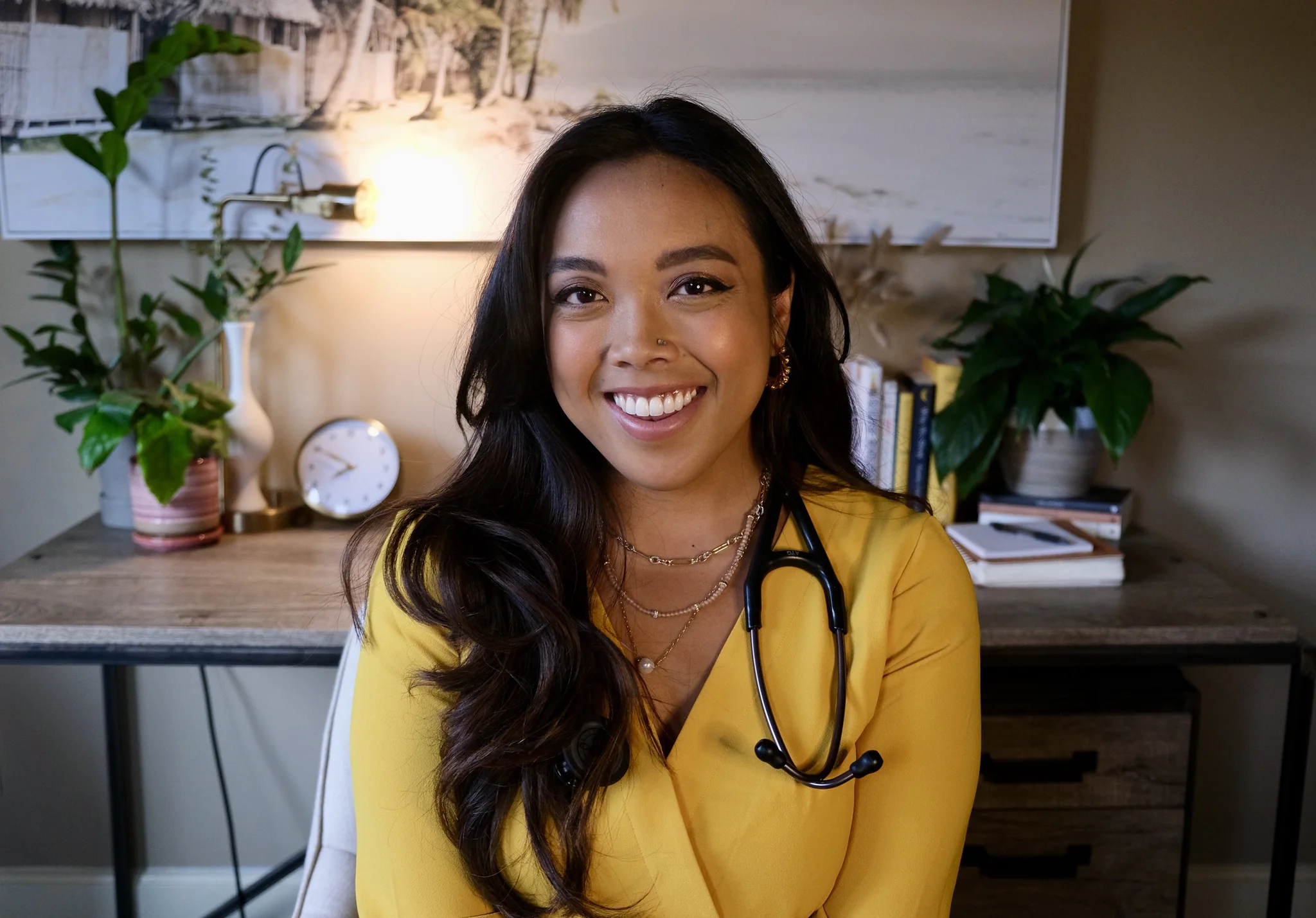 Dr. Lexi Gonzales in a yellow top with a stethoscope